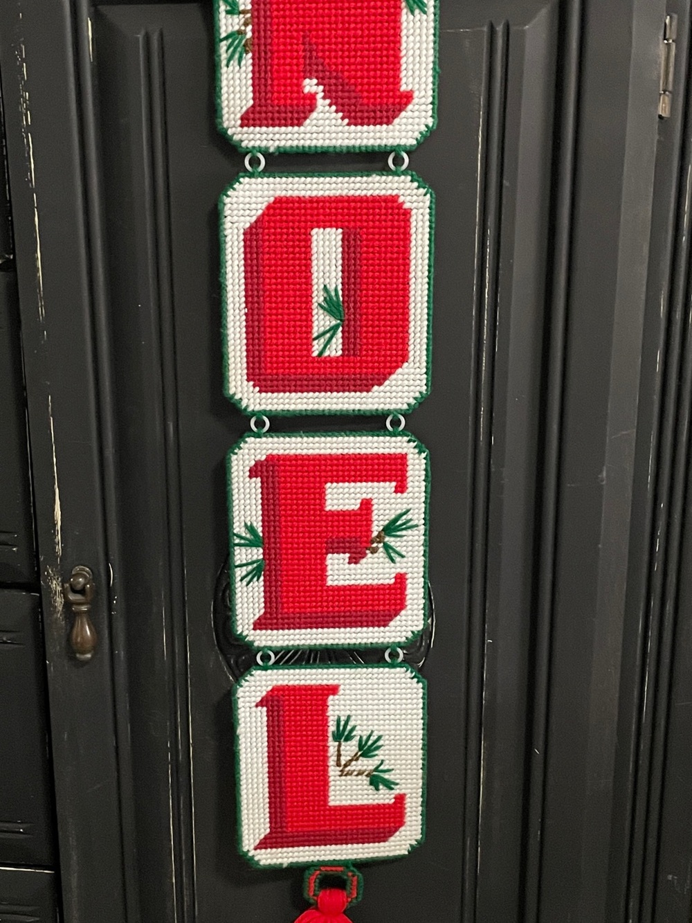 Handmade plastic canvas needlepoint NOEL Christmas hanging decoration.
